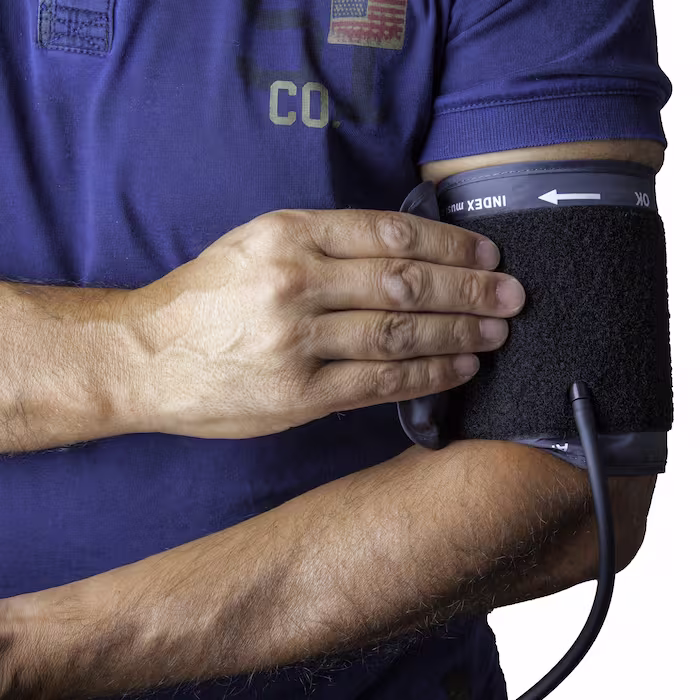 Doctor checking blood pressure related to garlic powder health benefits